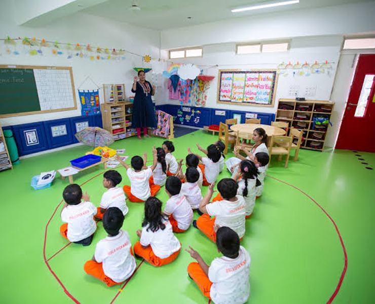 Kindergarten students in circle time with their teacher