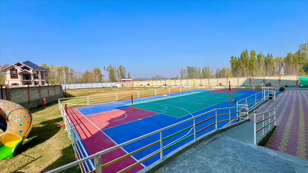 Outdoor multi-sport court and playground at Birla Open Minds International School, HMT Srinagar