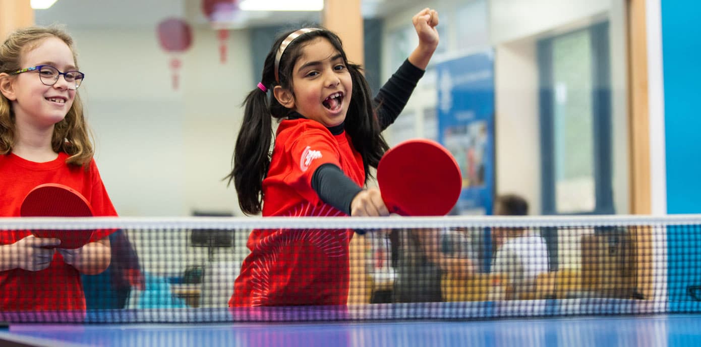 Students playing table tennis